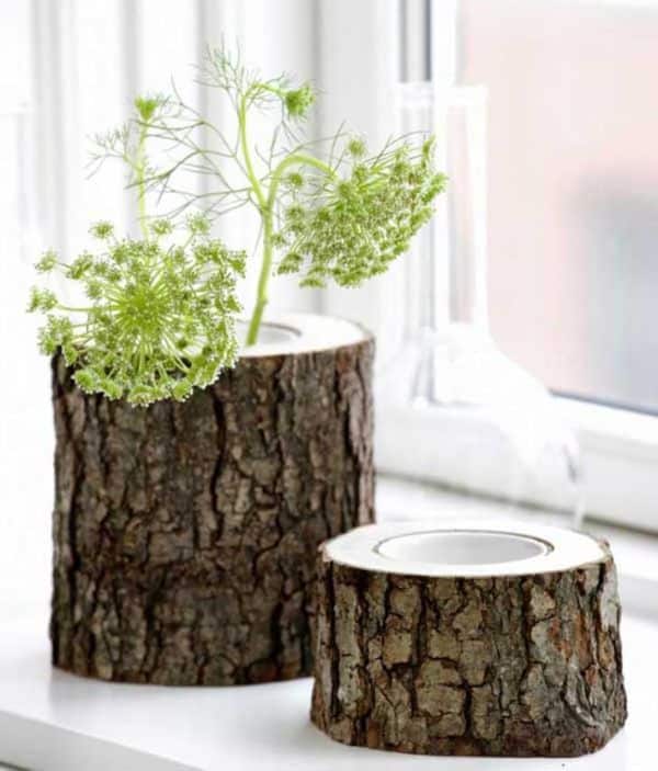 manualidades con troncos de árboles floreros